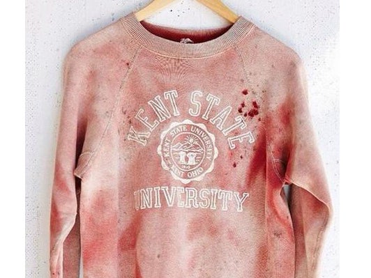 The Kent State sweatshirt is shown with "blood" spots on the left