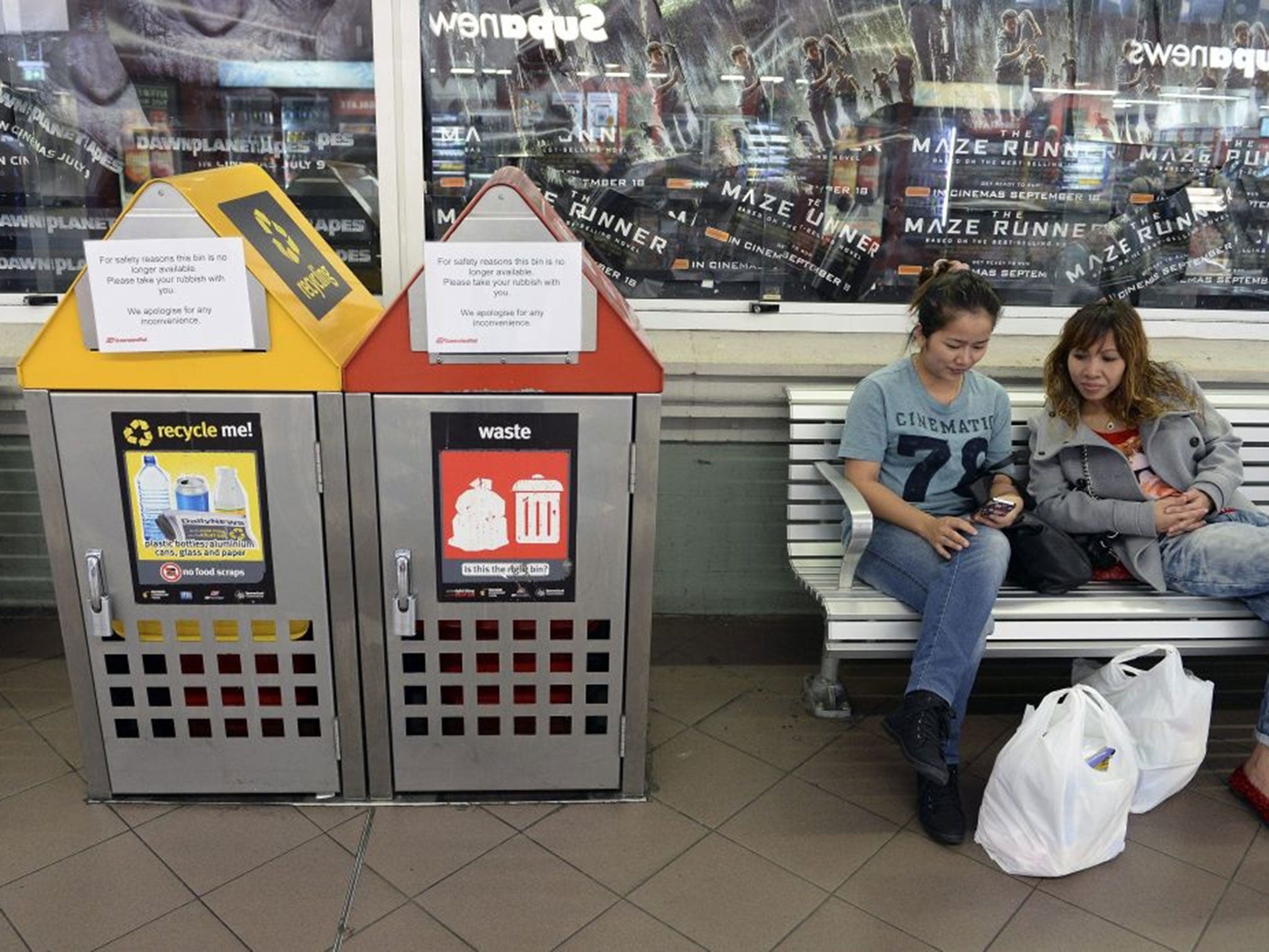 Rubbish bins are blocked with warning messages about public safety at Central rail station in Brisbane