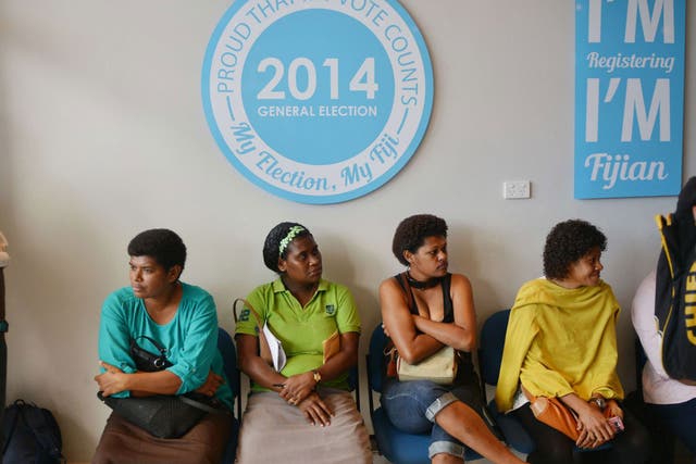 People wait to have lost election cards replaced at the election office for the upcoming elections in Suva, the capital. Fiji has imposed a strict media blackout of coverage of the South Pacific nation's first elections since a 2006 military coup, warning
