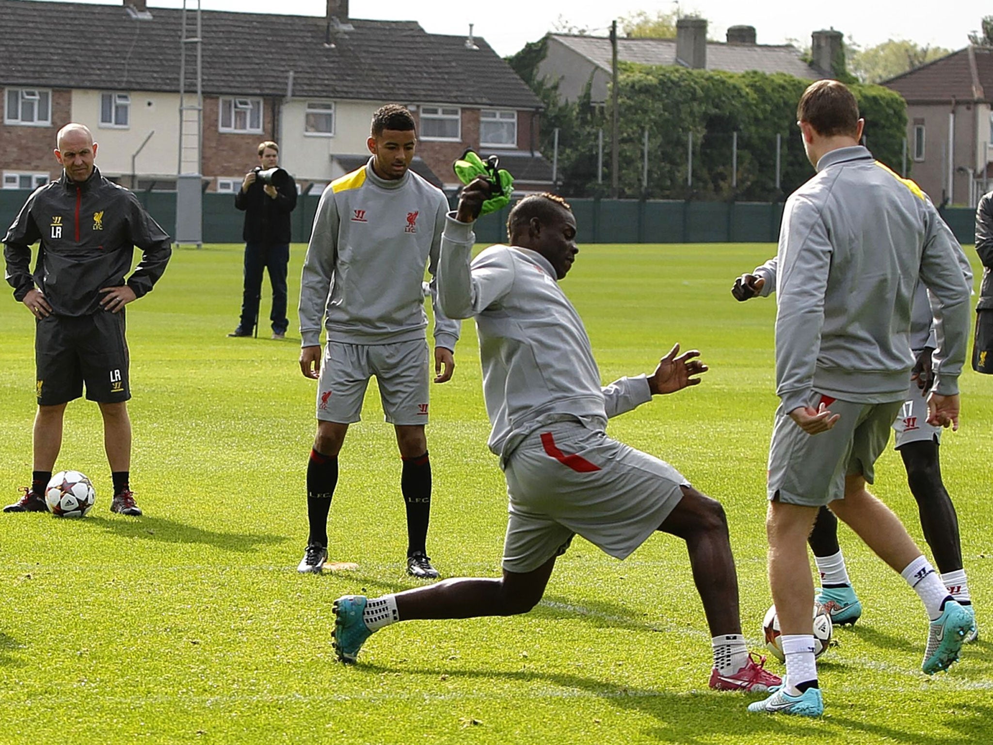 Liverpool’s Mario Balotelli tries to regain possession during Monday’s training session