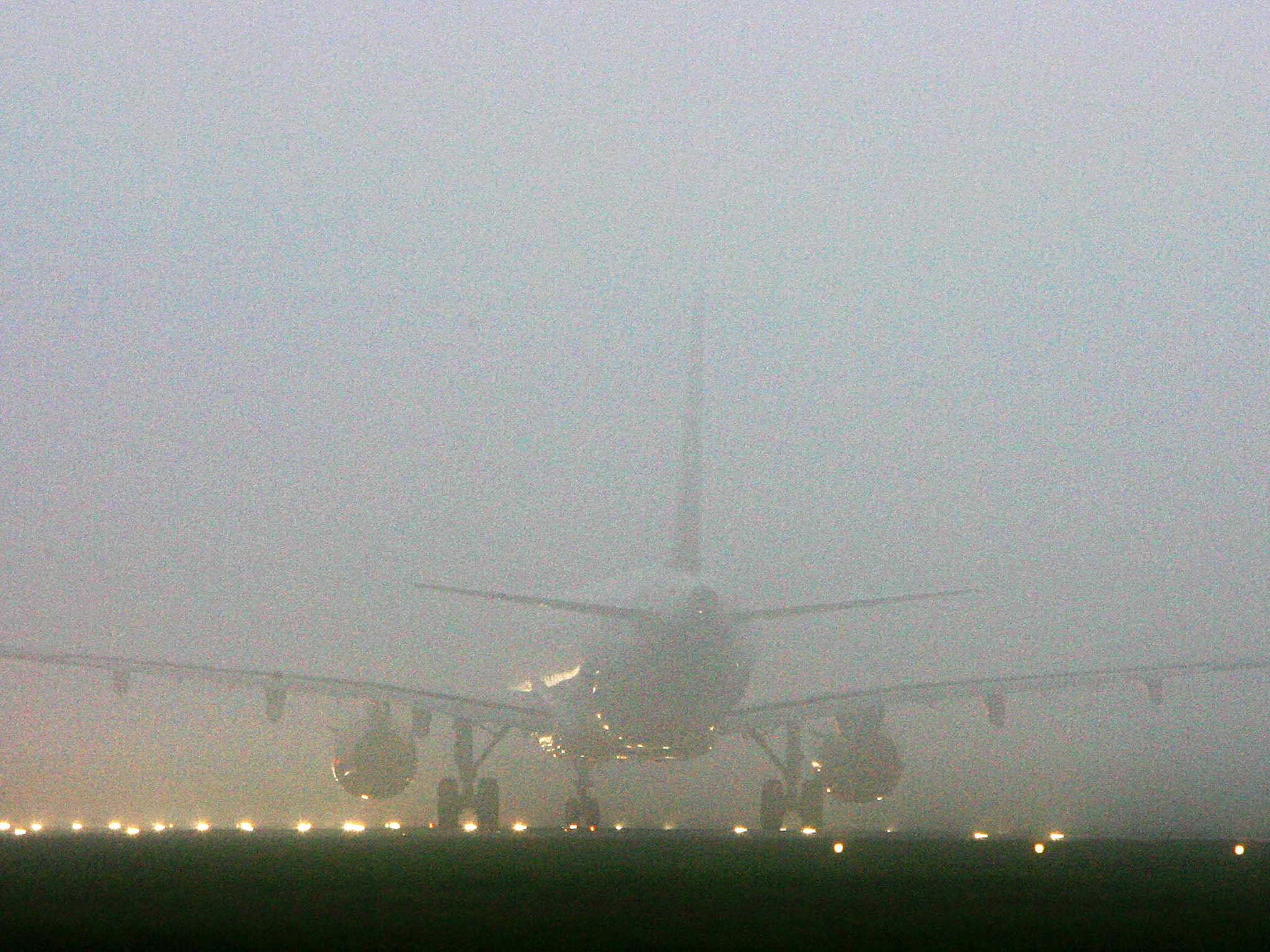 A plane is engulfed by fog at Heathrow airport in 2006