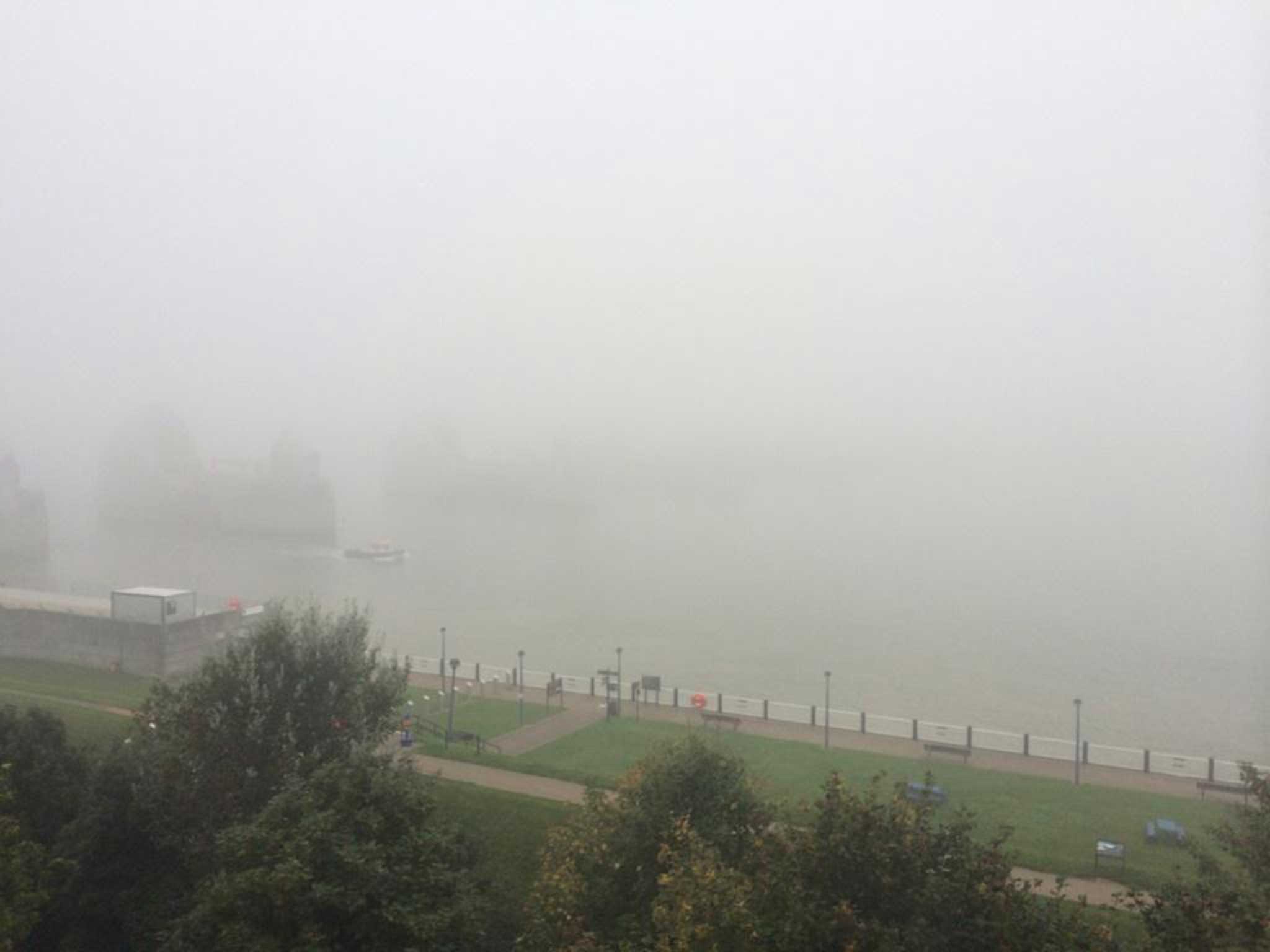 A views of the Thames bank shrouded in fog this morning