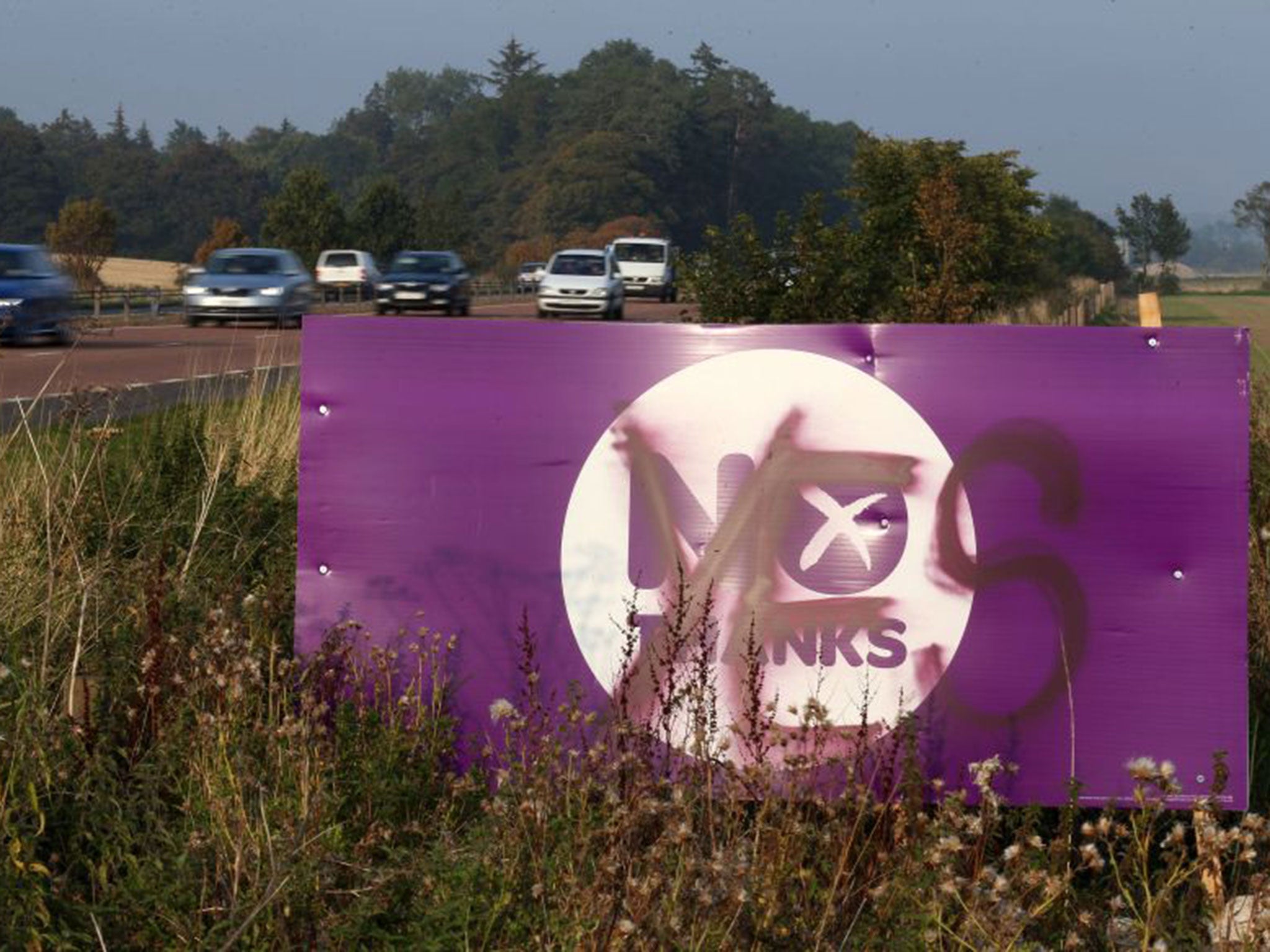 A graffitied Scottish Referendum sign on the A90 road near Dundee. The city has earned the label of Yes City for its allegedly rock-solid support for independence