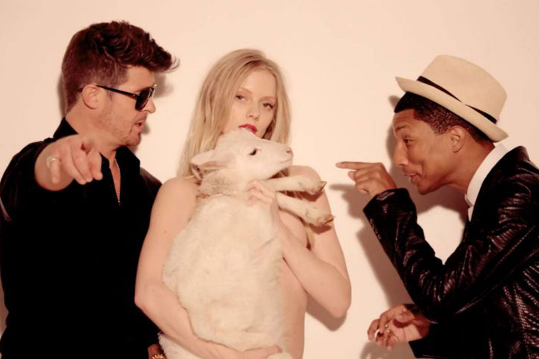 Robin Thicke and Pharell Williams in the video of the song, which has been accused of justifying rape