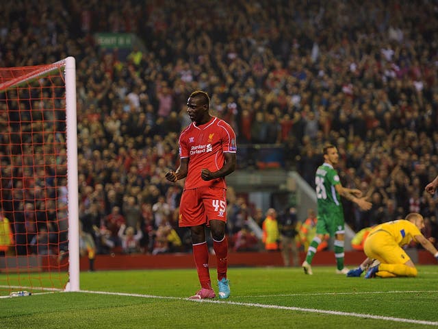 Mario Balotelli celebrates his first Liverpool goal