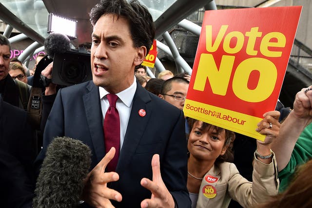 Labour Party leader Ed Miliband addresses the public and media as he walks in Edinburgh 