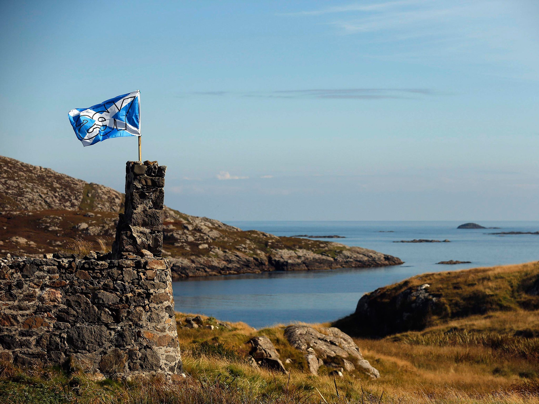 A "Yes" campaign flag flies from a derelict cottage on the Island of Barra in the Outer Hebrides