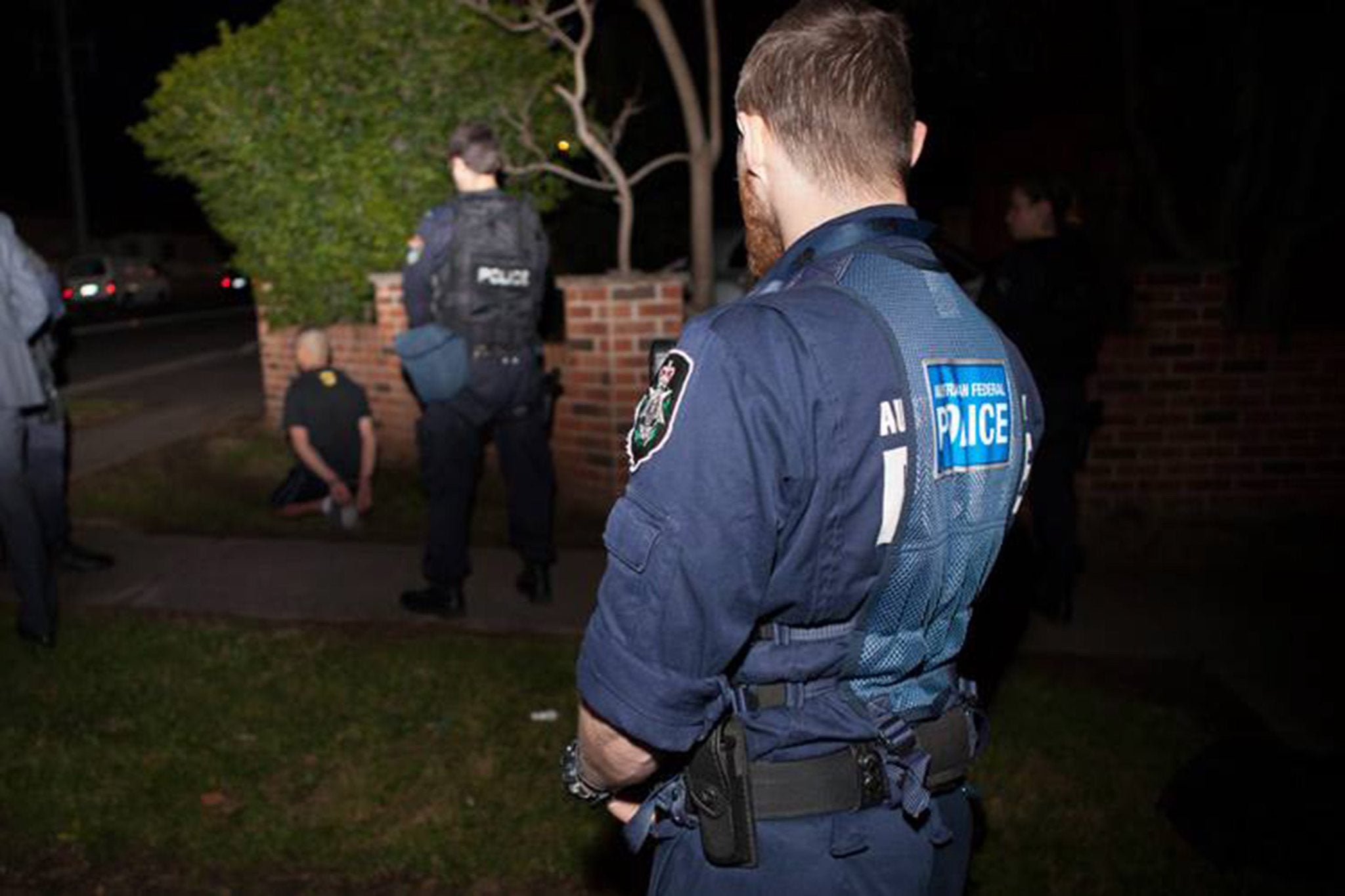 Fifteen people have been detained and one person charged with terrorism offences following pre-dawn raids across Sydney and Brisbane