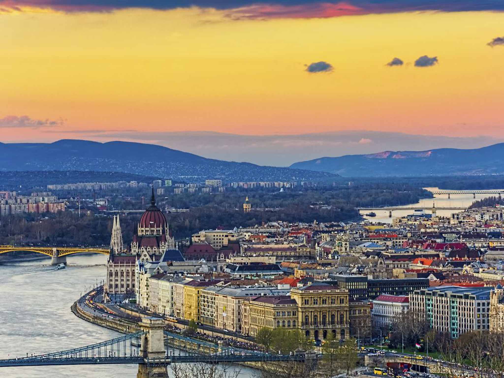 The river meanders its way from Germany's Black Forest through 10 countries, its vast 2,860km ending in spectacular display at Romania's Danube Delta. Pictured is the river in Budapest