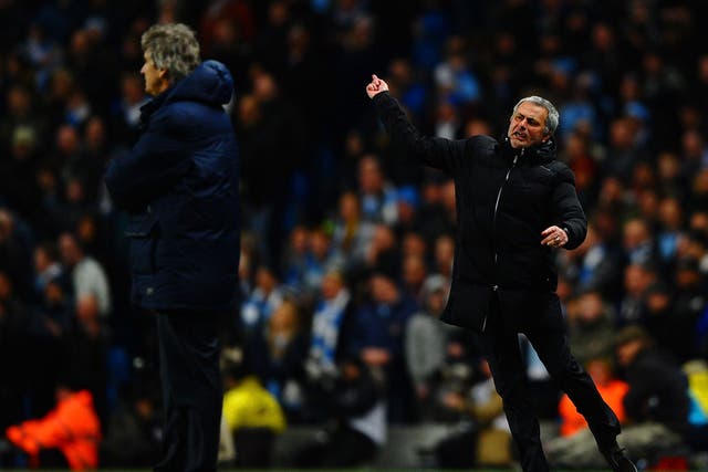 Manuel Pellegrini manager of Manchester City looks on as Jose Mourinho manager of Chelsea reacts during the Barclays Premier League match between Manchester City and Chelsea at Etihad Stadium on February 3, 2014.