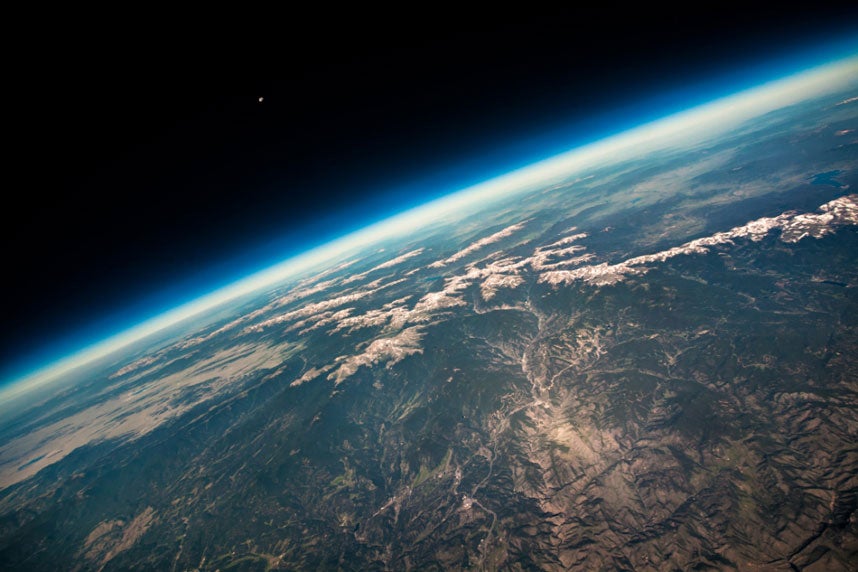Poised on the brink of space, this astonishing shot shows the curvature of the Earth with the towering Rocky Mountains reduced to tiny wrinkles on the surface below. Taken with the aid of a high altitude balloon, launched from Boulder, Colorado, the photograph captures the breath-taking view of the Earth from 87,000 feet about its surface. The tiny dot of the Moon pictured in the distance emphasizes the vast expanse between our planet and its nearest cosmic neighbour.