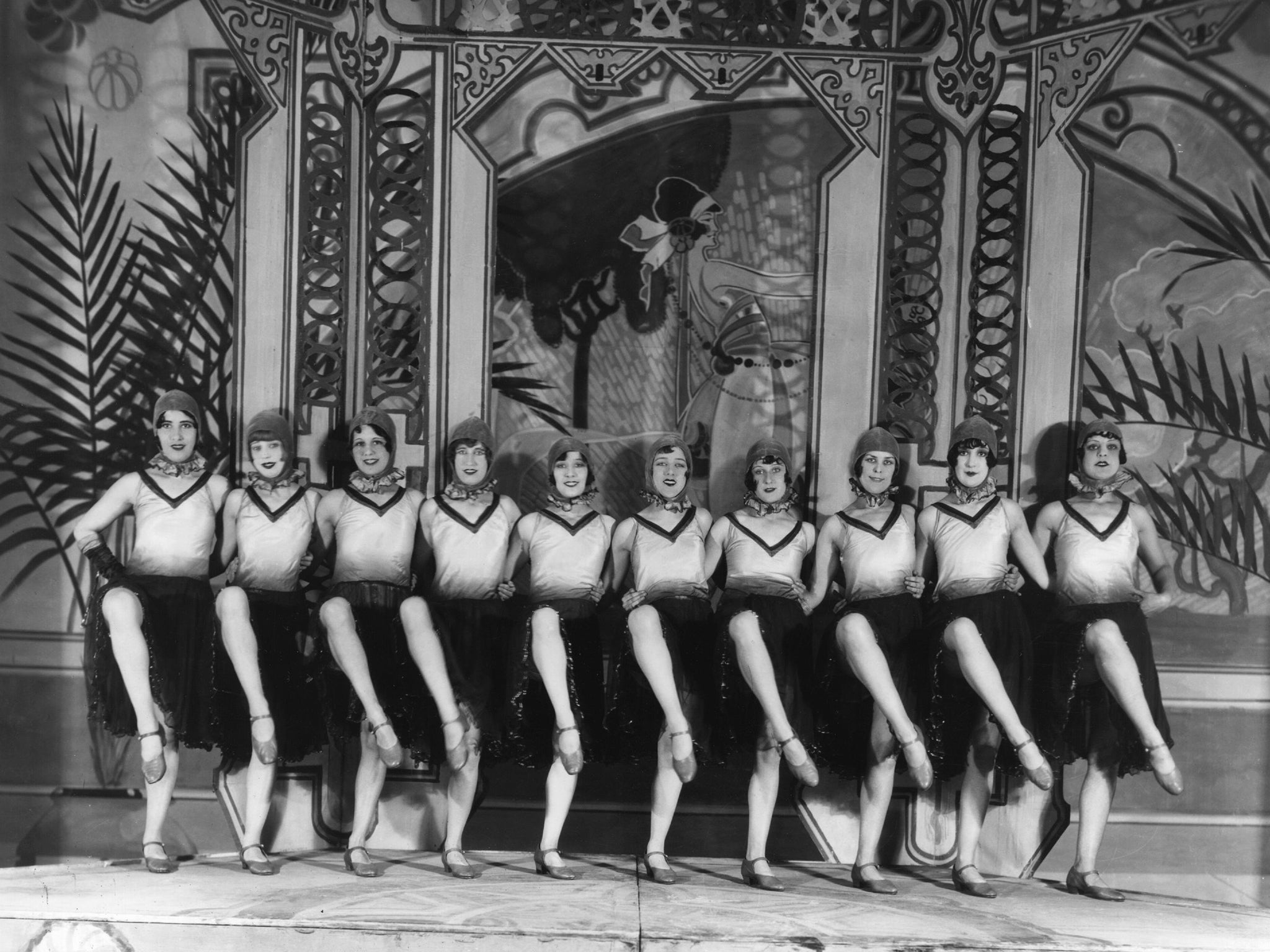 A dance troupe performs in a scene from the Brighton Hippodrome's production of 'Love And Money' circa 1927