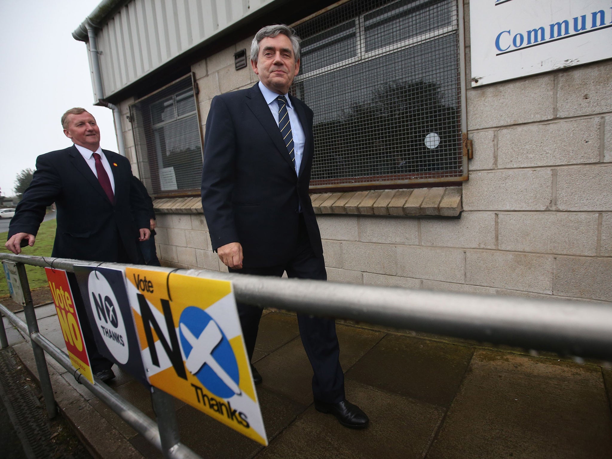 Former Prime Minister Gordon Brown with No campaigners outside the polling station at North Queensferry Community Centre as polls open