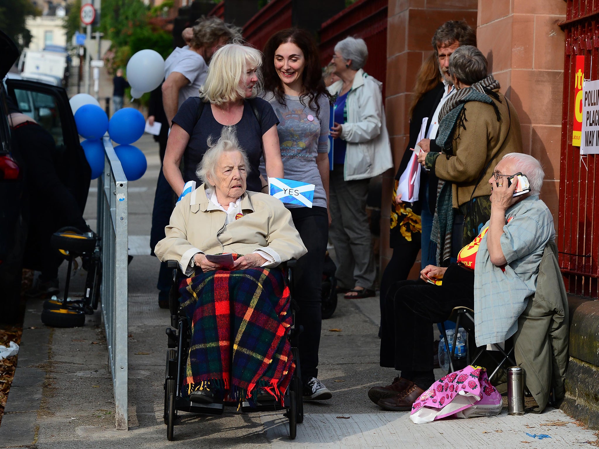 Voters come to Notre Dame Primary School polling station as the people of Scotland take to the polls to decide their country's fate