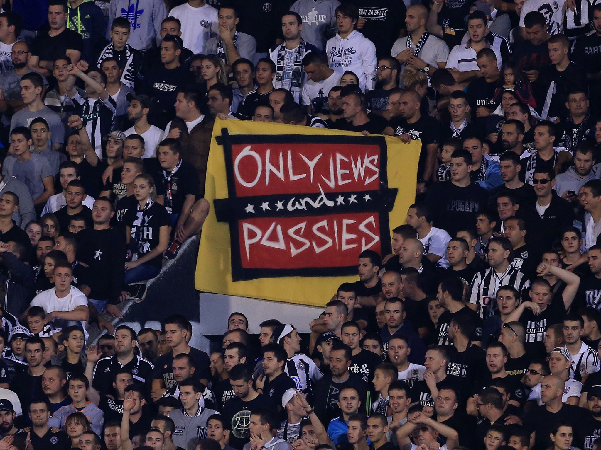 A section of Partizan fans display an anti-semitic banner during the club's Europa League match between Partizan and Tottenham Hotspur
