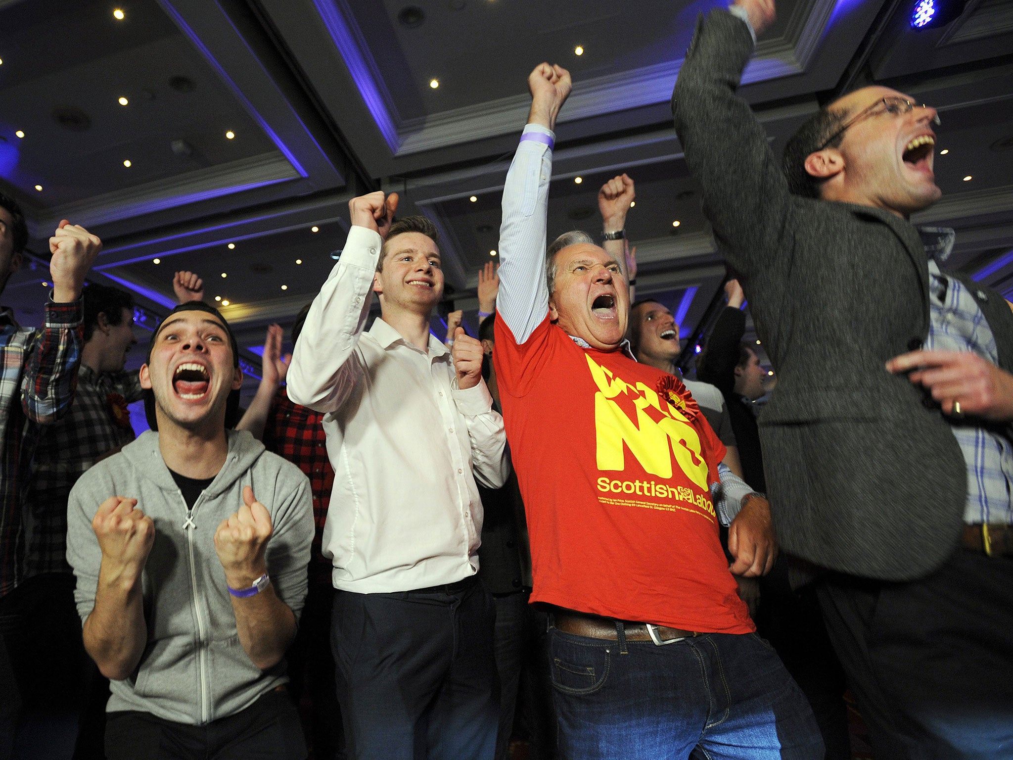 Pro-union supporters react as Scottish independence referendum results come in at a Better Together event in Glasgow