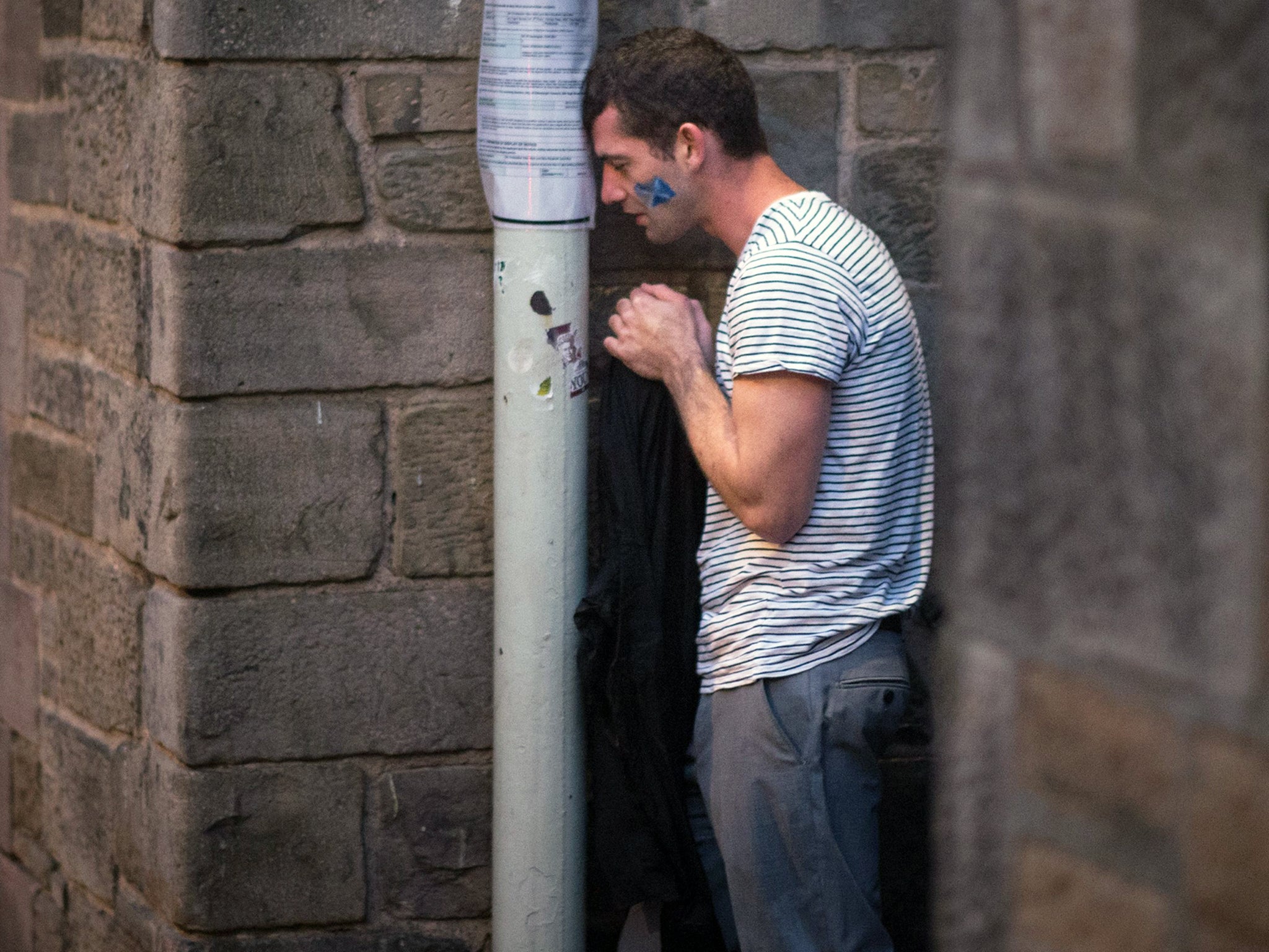 A dejected 'Yes' supporter in Edinburgh makes his way home in the early hours after Scotland voted decisively to reject independence and remain part of the Union (PA)