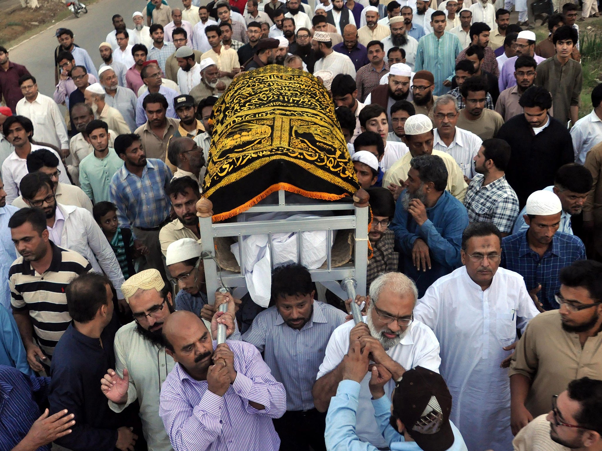 Pakistani people and relatives attending the funeral of Muhammad Shakil Auj, head of Islamic Studies at Karachi University, who was killed by unknown gunmen in restive Karachi, Pakistan