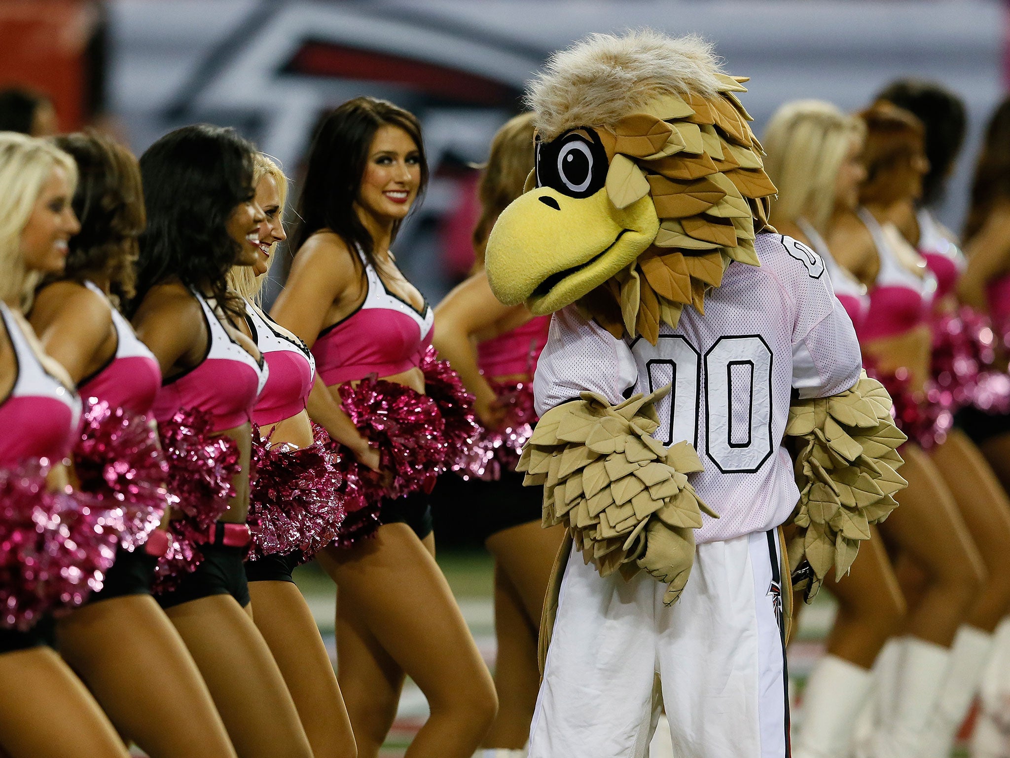 Freddie the Falcon dances with the Atlanta Falcons cheerleaders