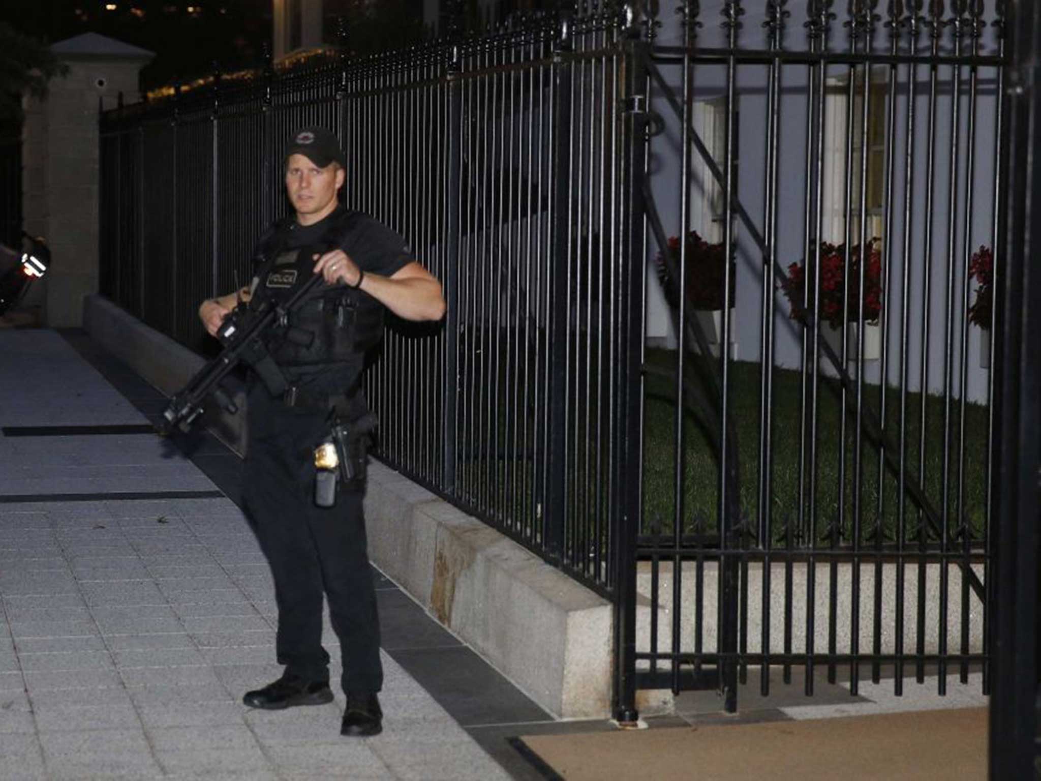 A heavily armed officer outside the White House