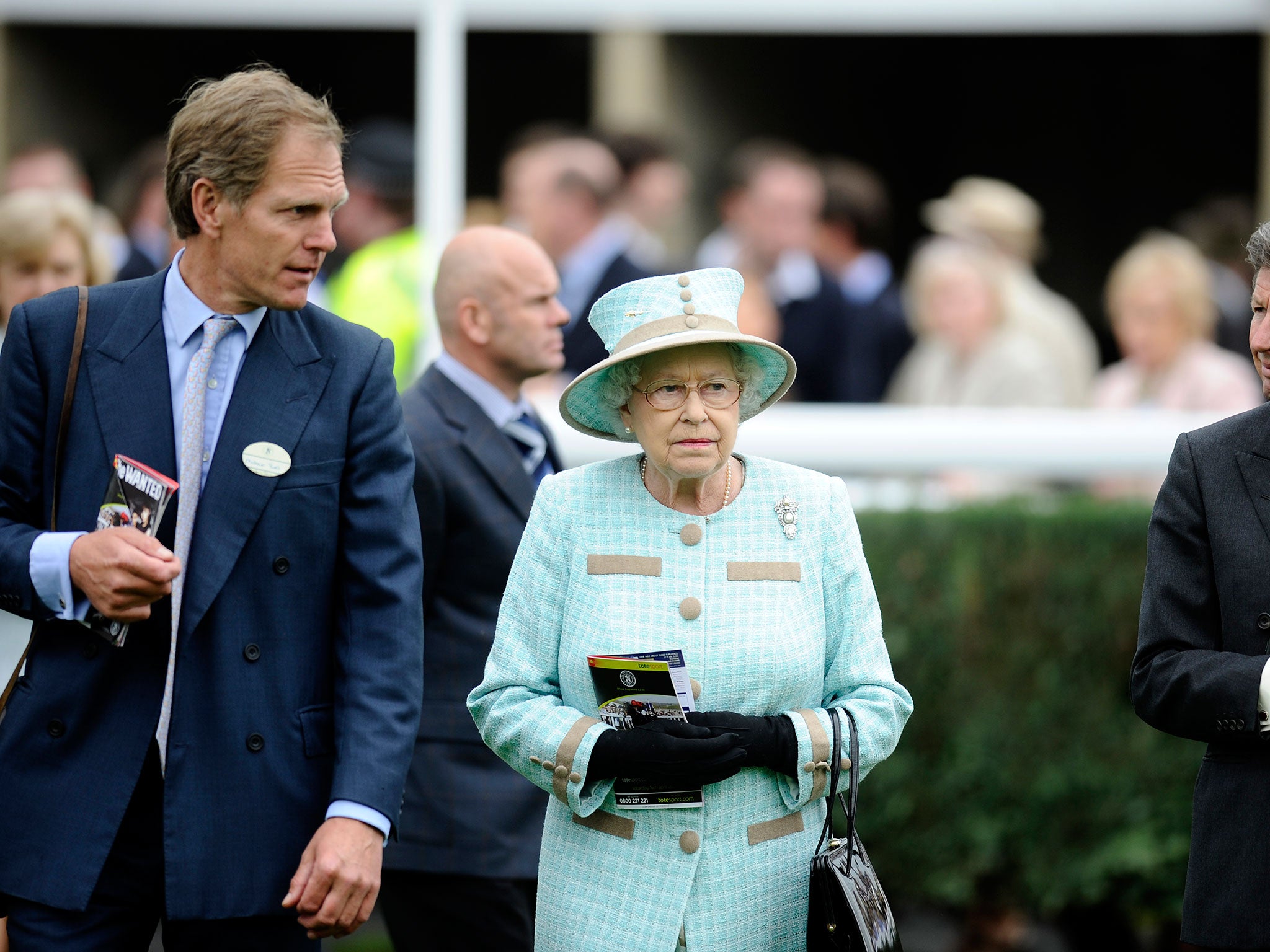 Queen Elizabeth II with trainer Michael Bell