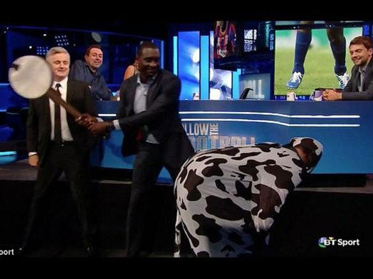 Emile Heskey hits a cow's backside with a banjo