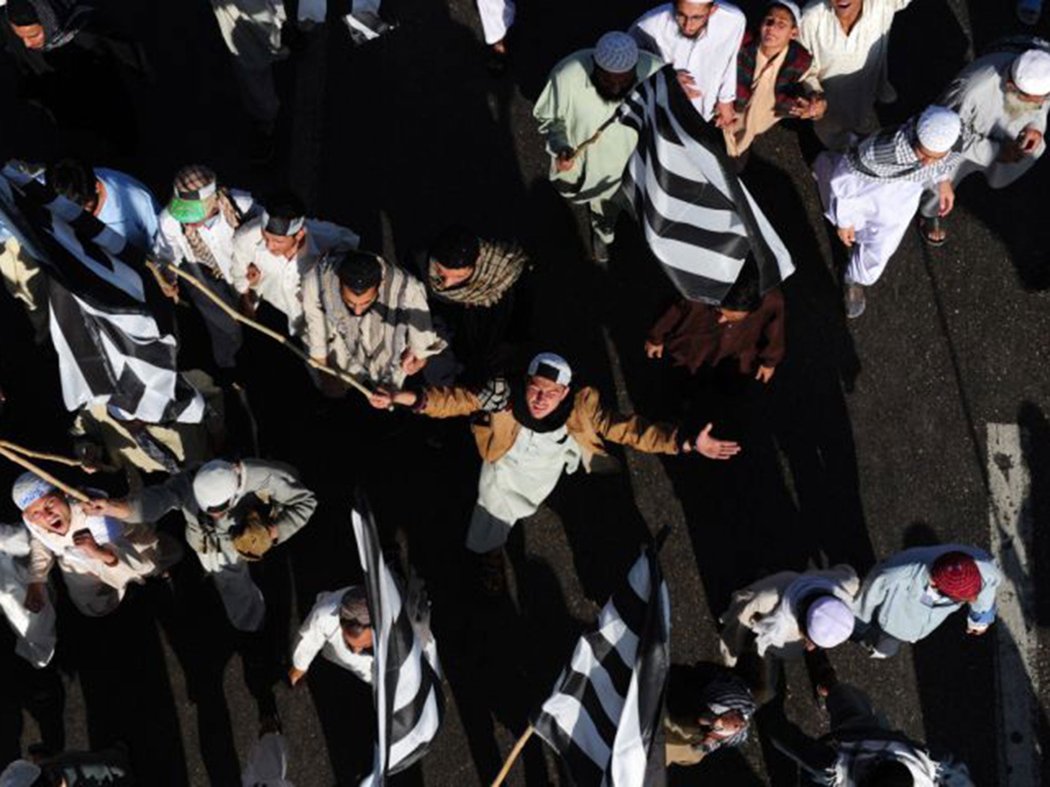 Pakistani Islamists shout slogans as they march during a rally in Karachi against the amendment of the Blasphemy law. More than 50,000 people rallied in Pakistan's southern city against the controversial reform of the law that was behind the killing of Mu