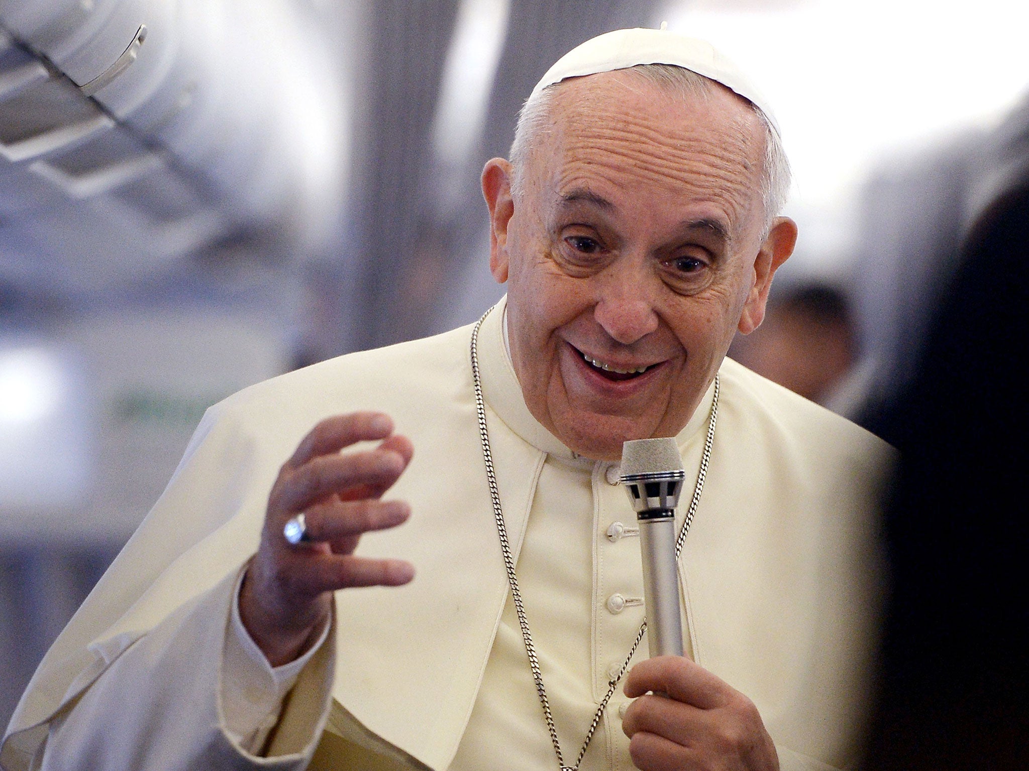 Pope Francis gives a press conference aboard the plane carrying him to Tirana, Albania on 21 September, 2014