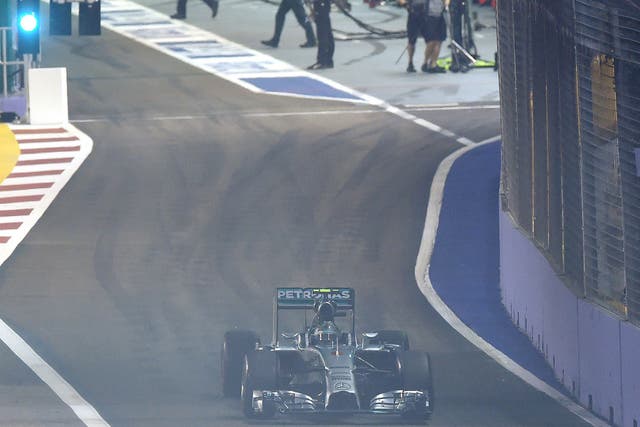 Mercedes driver Nico Rosberg of Germany starts from the pit during the Singapore Grand Prix 