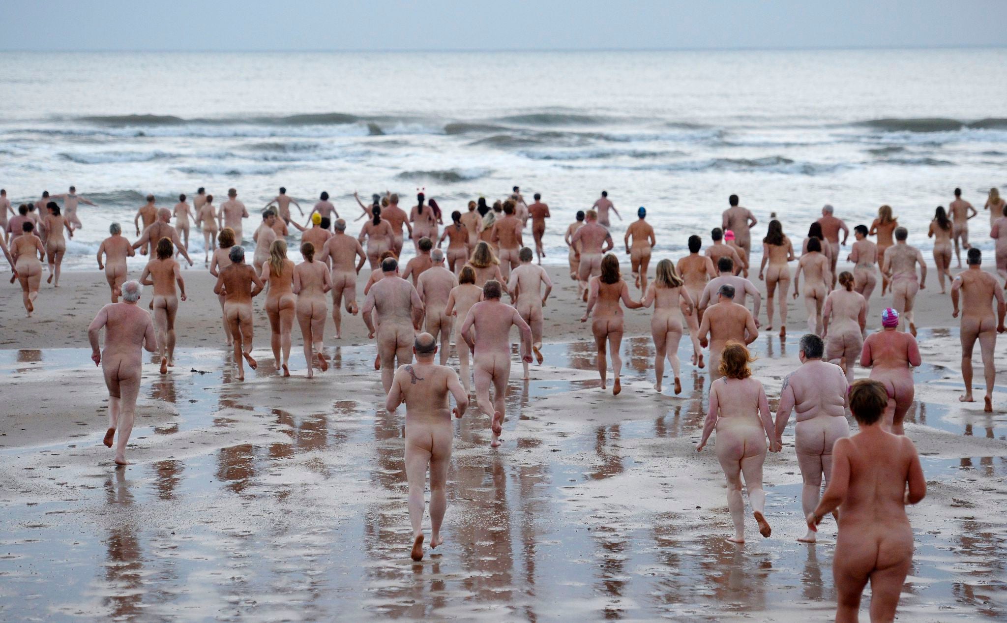 Over 350 nude people take to the water at Druridge Bay in Northumberland on 21 September