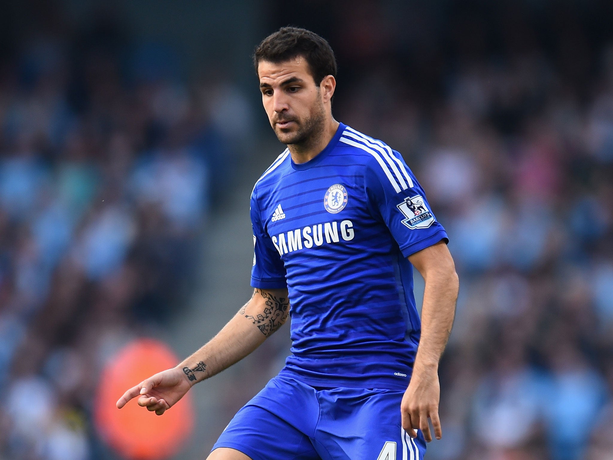  Cesc Fabregas playing for Chelsea, not Arsenal, during a match at the Etihad Stadium.