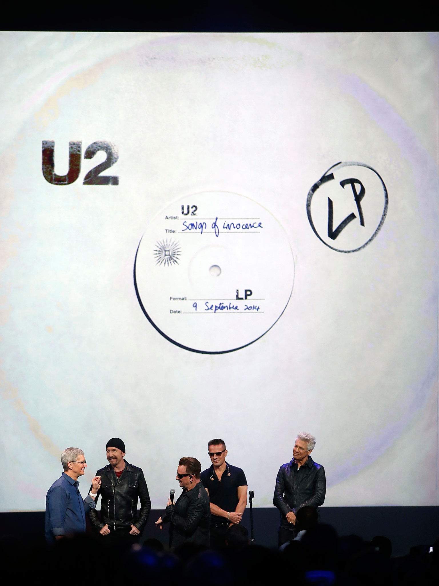 Apple CEO Tim Cook, far left with U2 at the launch of the iPhone 6 and Apple Watch in California