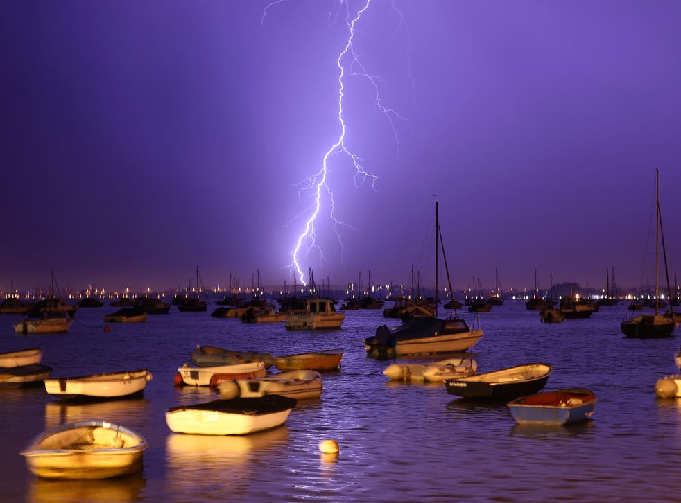 Lightning strikes over Poole Harbour during a thunderstorm 