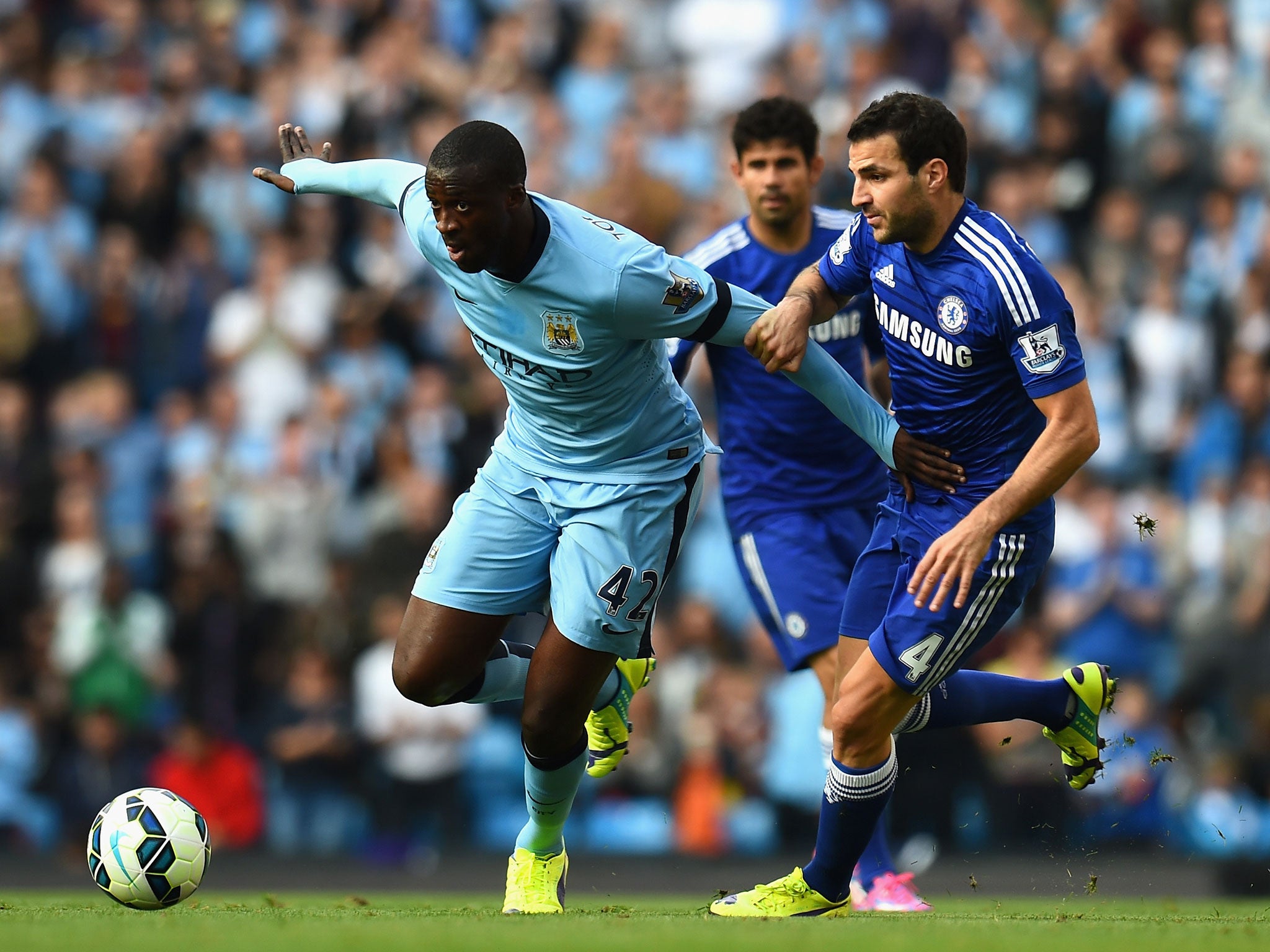 Yaya Touré in action for Manchester City against Chelsea yesterday. Conflicting versions of his relationship with City have emerged