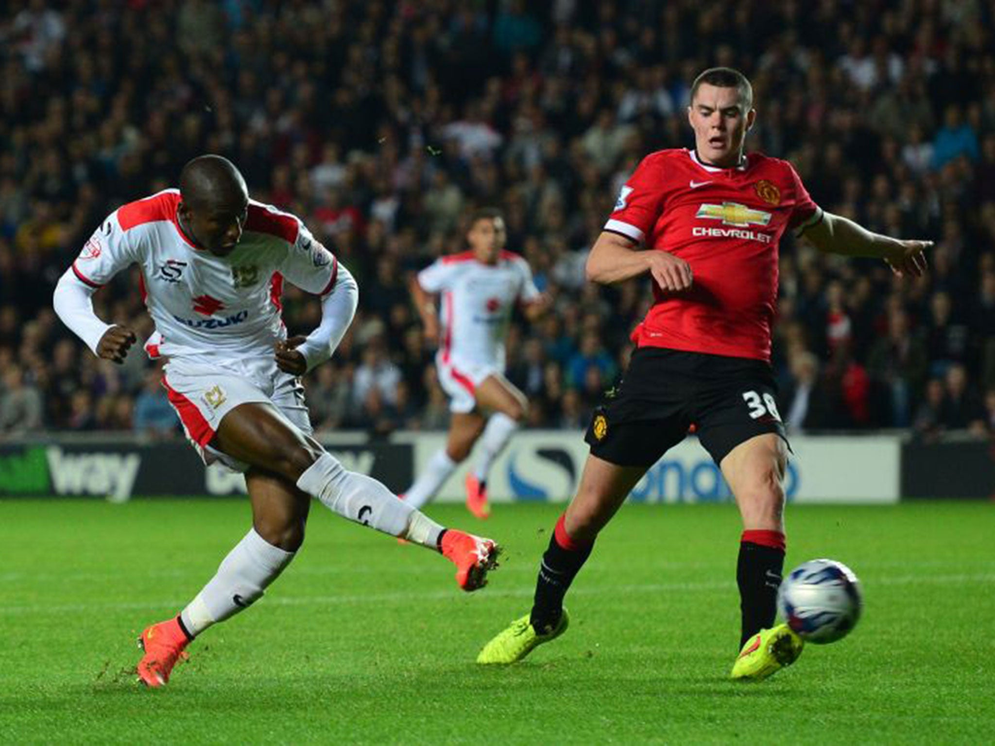 Benik Afobe scores against Manchester United for MK Dons