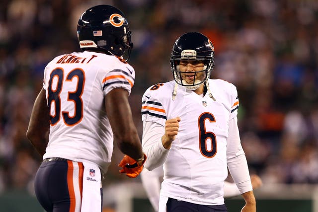 Jay Cutler celebrates with Martellus Bennett after hitting the tight end for a touchdown