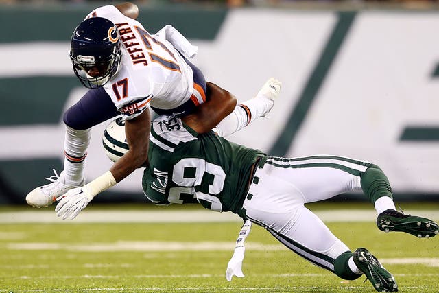 Wide receiver Alshon Jeffery of the Chicago Bears is tackled by free safety Antonio Allen of the New York Jets