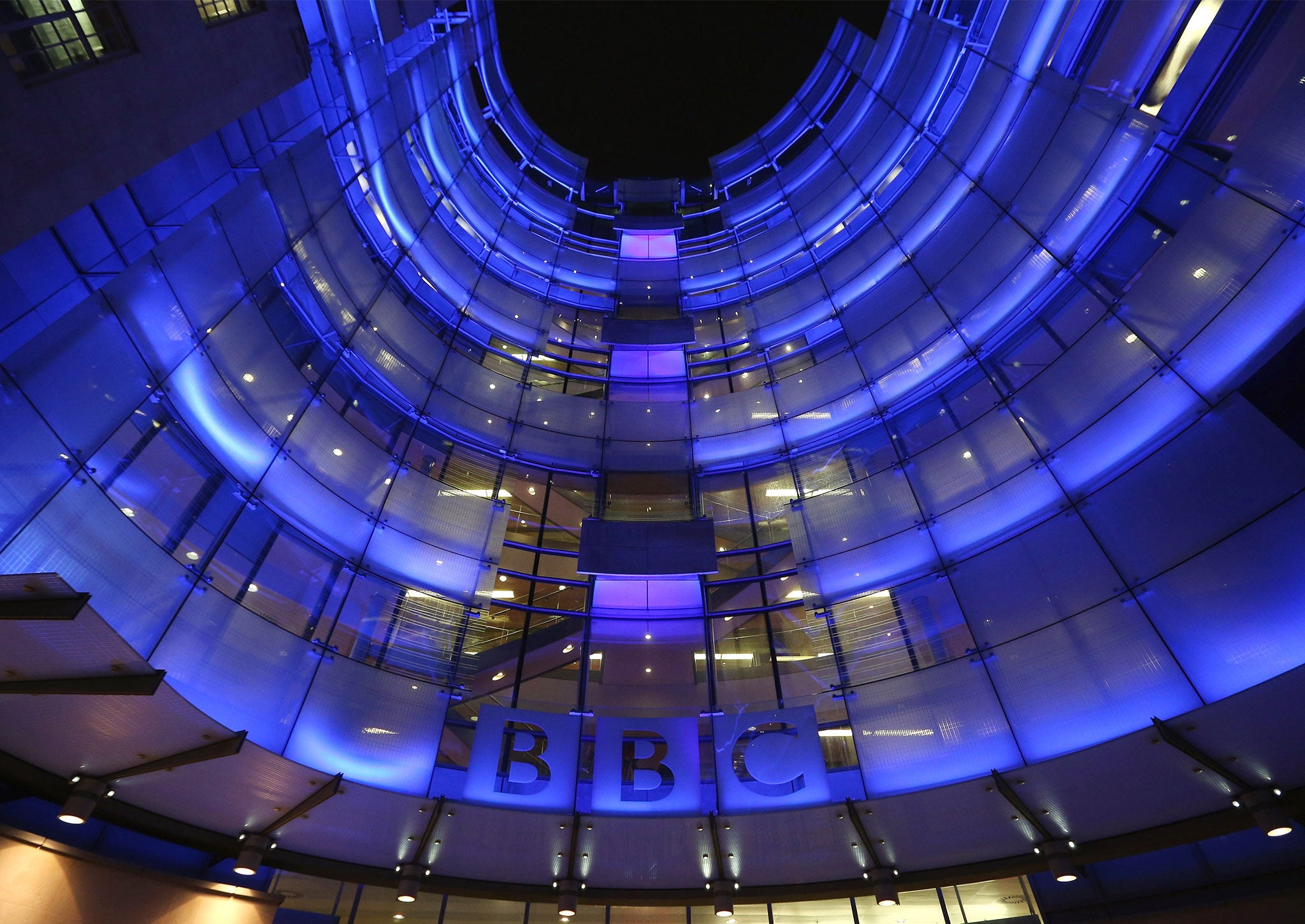 The BBC headquarters at New Broadcasting House is illuminated at night in London, England.