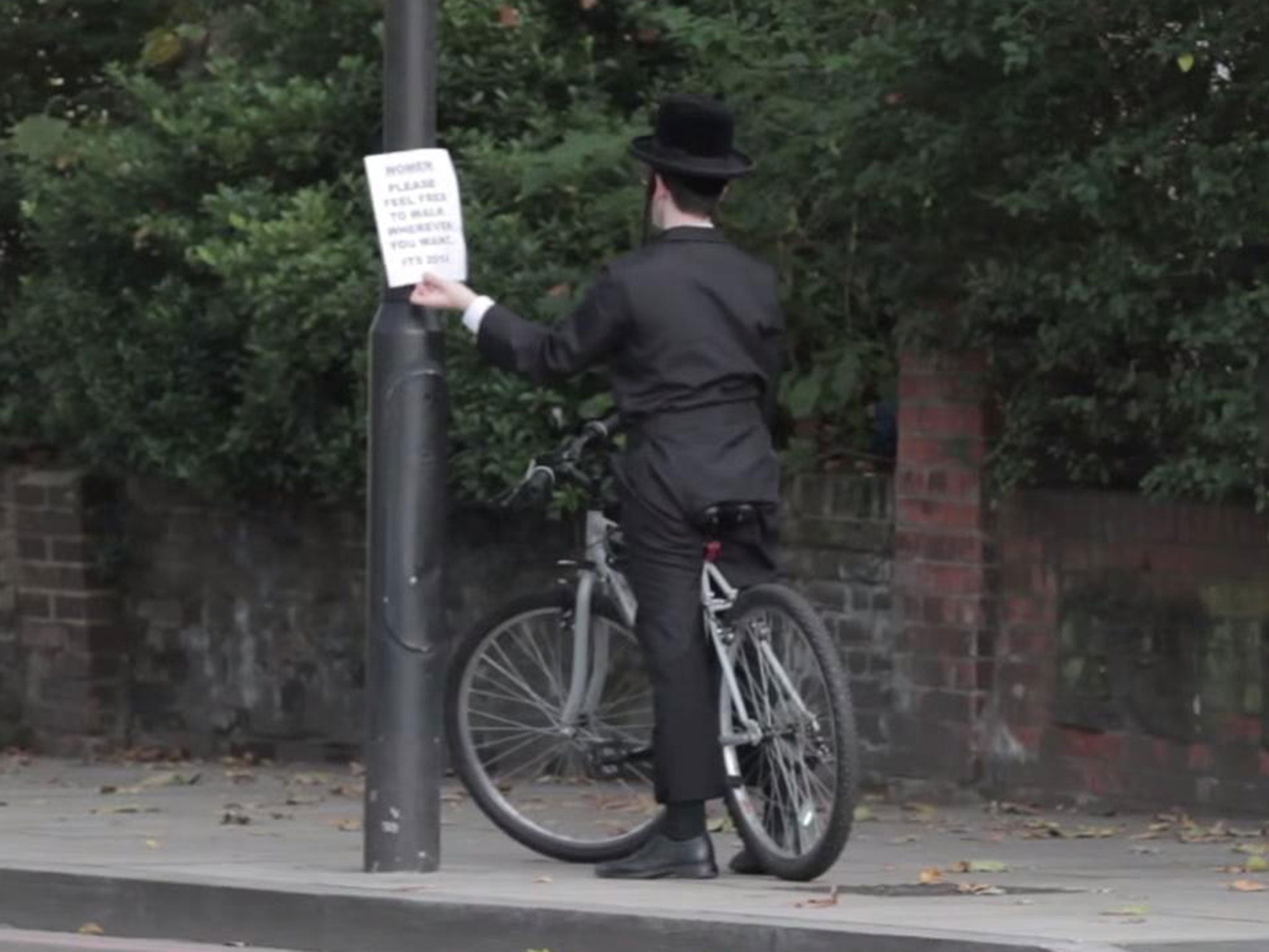 A Haredi Jewish boy was filmed taking down one of the alternative posters