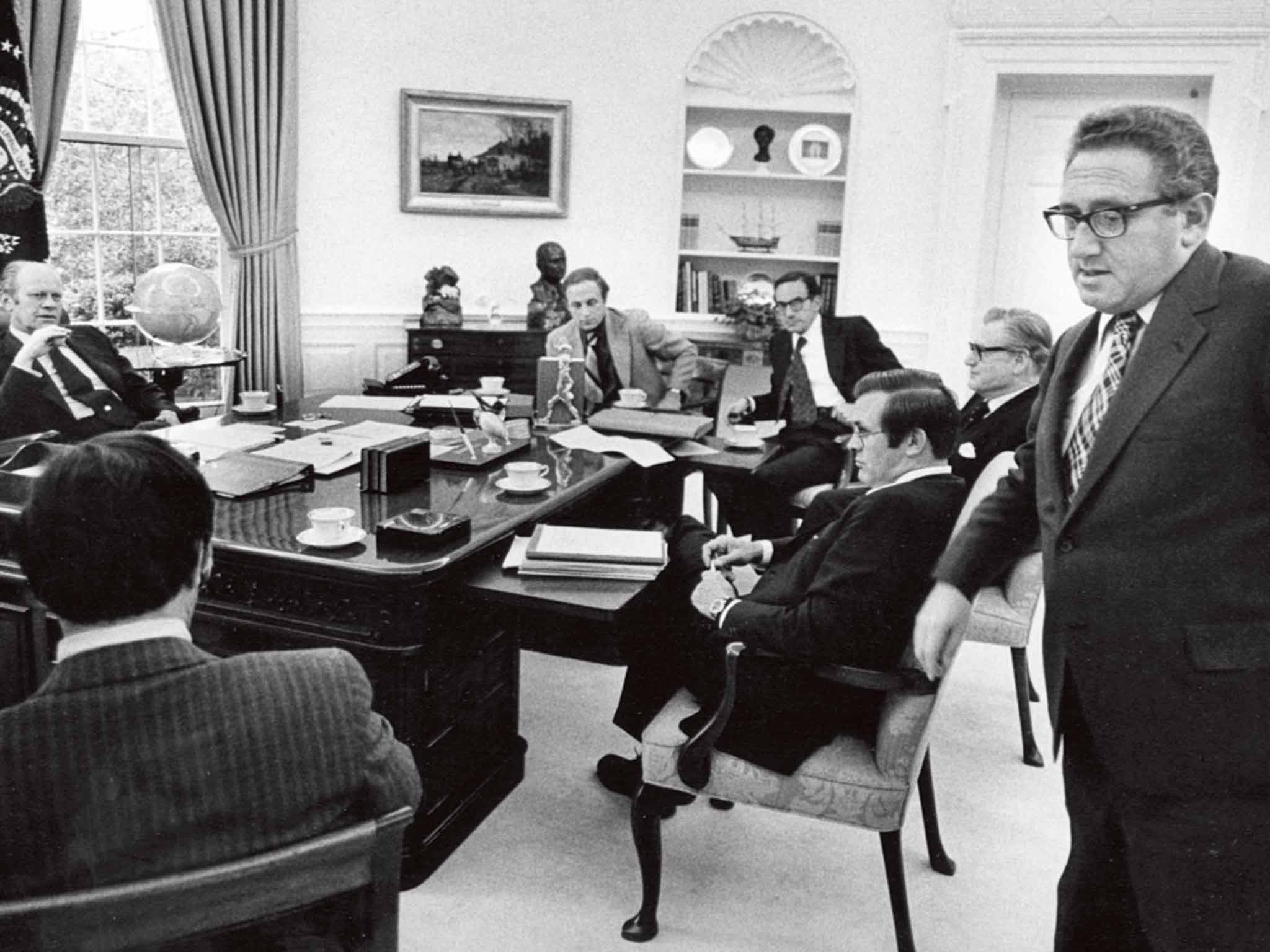 President Ford holding a meeting in 1975, when Kissinger (right) was Secretary of State