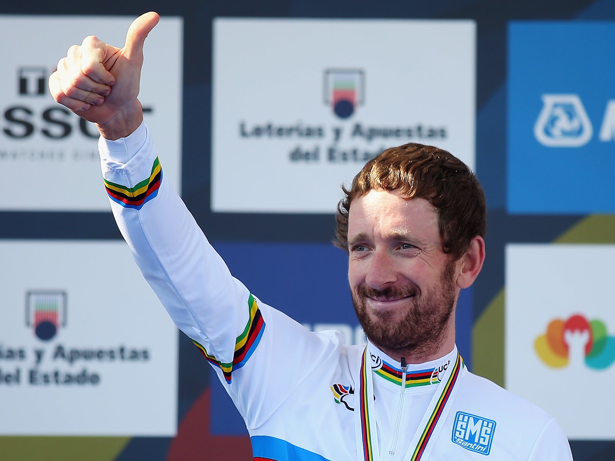 Sir Bradley Wiggins of Great Britain stands on the podium after winning the Elite Men's Individual Time Trial on day four of the UCI Road World Championships