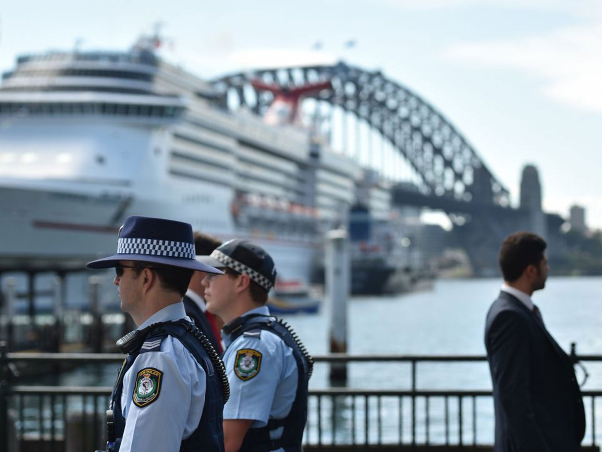 Police patrol Sydney harbour after a “known terror suspect” who stabbed two officers was shot dead a day after Isis called for Muslims to indiscriminately kill Australians