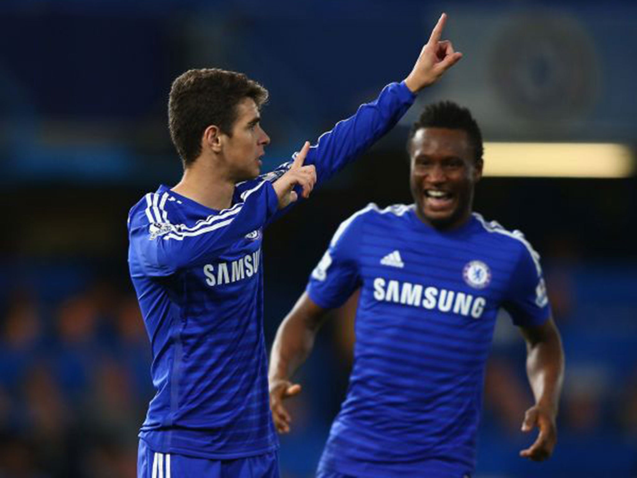 Oscar, left, celebrates his goal with John Obi Mikel