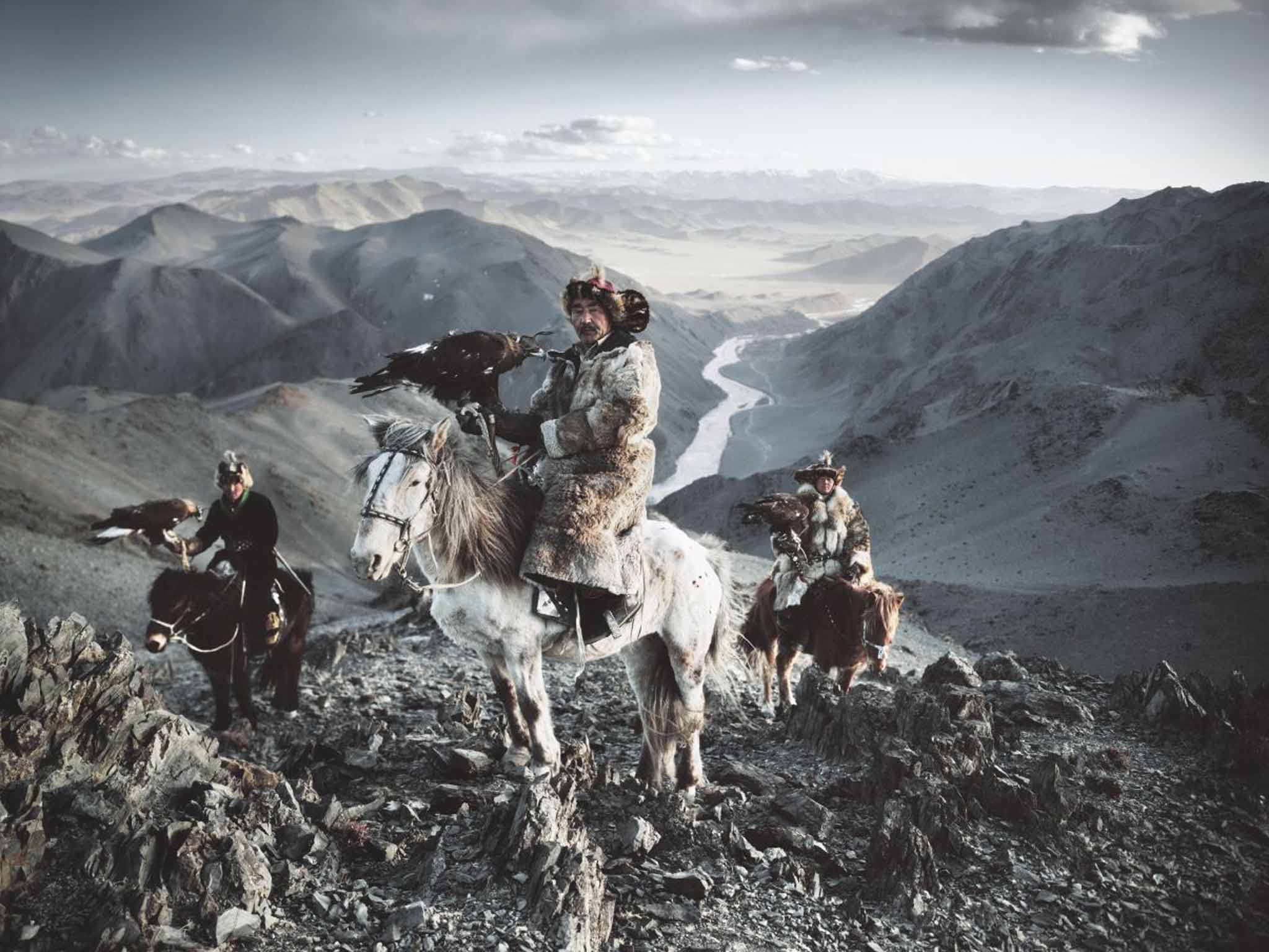 Hunters, Altantsogts province, Mongolia: Only 400 members of the Kazakh tribe still hunt with golden eagles on the Mongolian steppes. The birds are given to the tribe members at puberty. This image cost Nelson the skin off his hand when it froze to his bulky plate camera in the sub-zero conditions