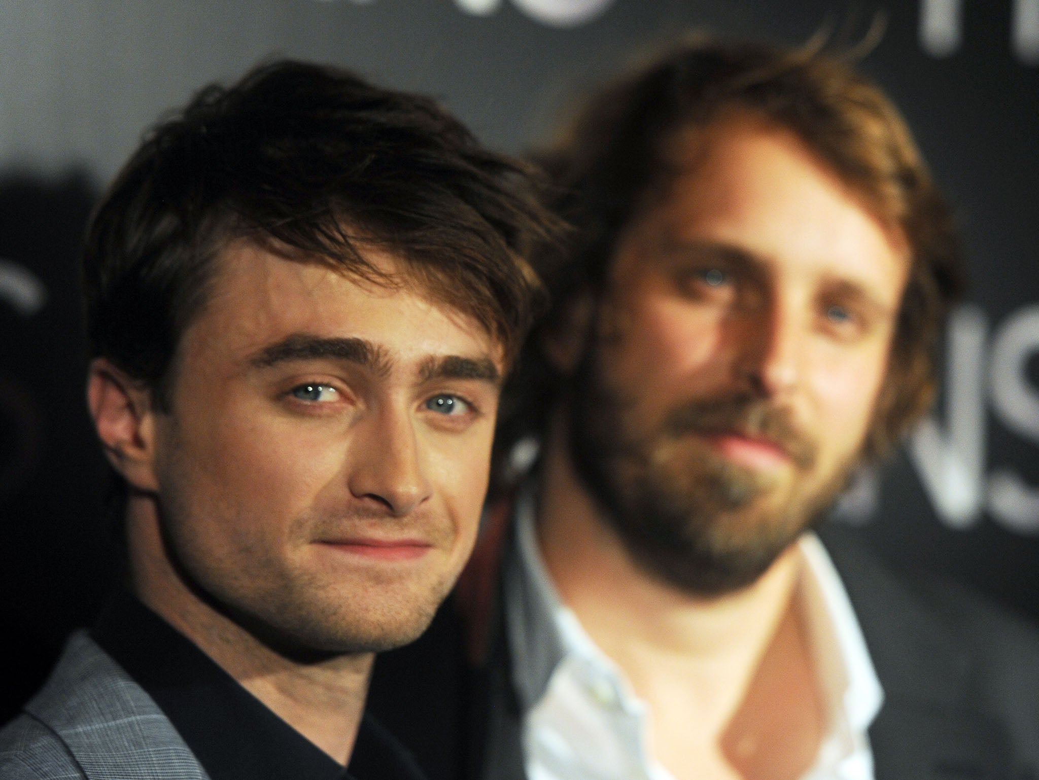 Daniel Radcliffe (L) and French director Alexandre Aja pose as they arrive for the premiere of their film Horns on 16 September