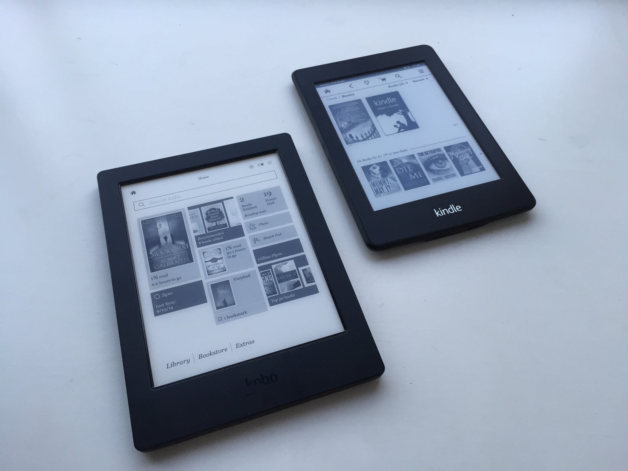 Side by side with the Kindle Paperwhite (right), and H2O looks a little chunky.