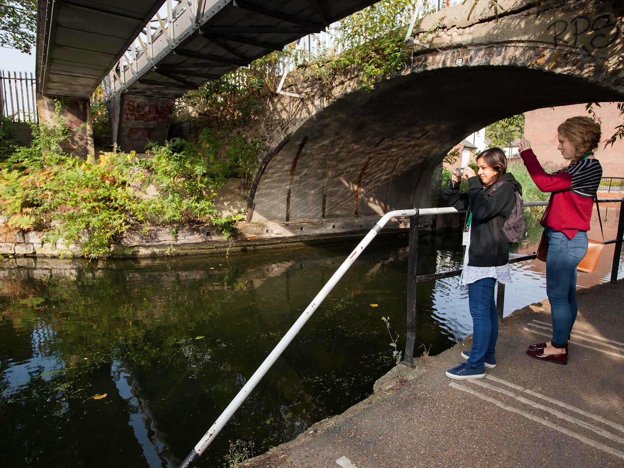 Undergraduate Geography students participate in research program as part of wider project to create worlds first urban national park. Next to canal in Mile End park east London.