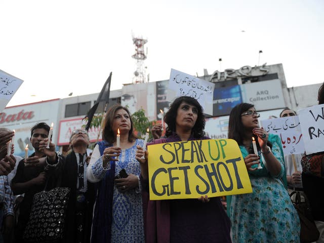 Rights activists protest at the killing of lawyer Rashid
Rehman in Islamabad in May