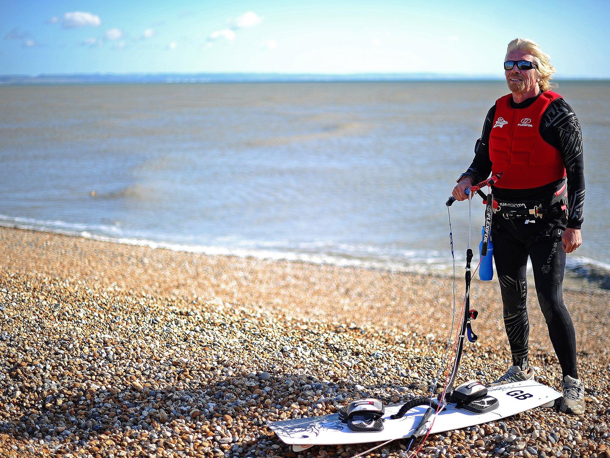 British tycoon adventurer Richard Branson prepares to begin his kite surfing world record attempt, from Dungeness in Kent, southern England to Boulogne, northern France, on August 24, 2010.