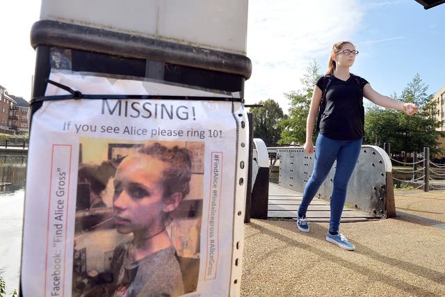 A police cadet walks across the bridge at the Brentford Locks as part of the reconstruction of the last known movements of missing schoolgirl Alice Gross